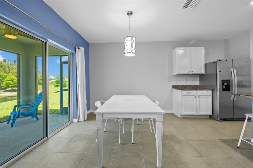 2721 Greenleaf Terrace Parrish, FL 34219 - Photo 29 of 65 a kitchen with stainless steel appliances granite countertop a stove a sink a refrigerator and a refrigerator