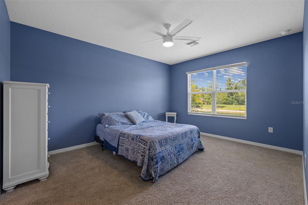 2721 Greenleaf Terrace Parrish, FL 34219 - Photo 31 of 65 a spacious bedroom with a bed and a window
