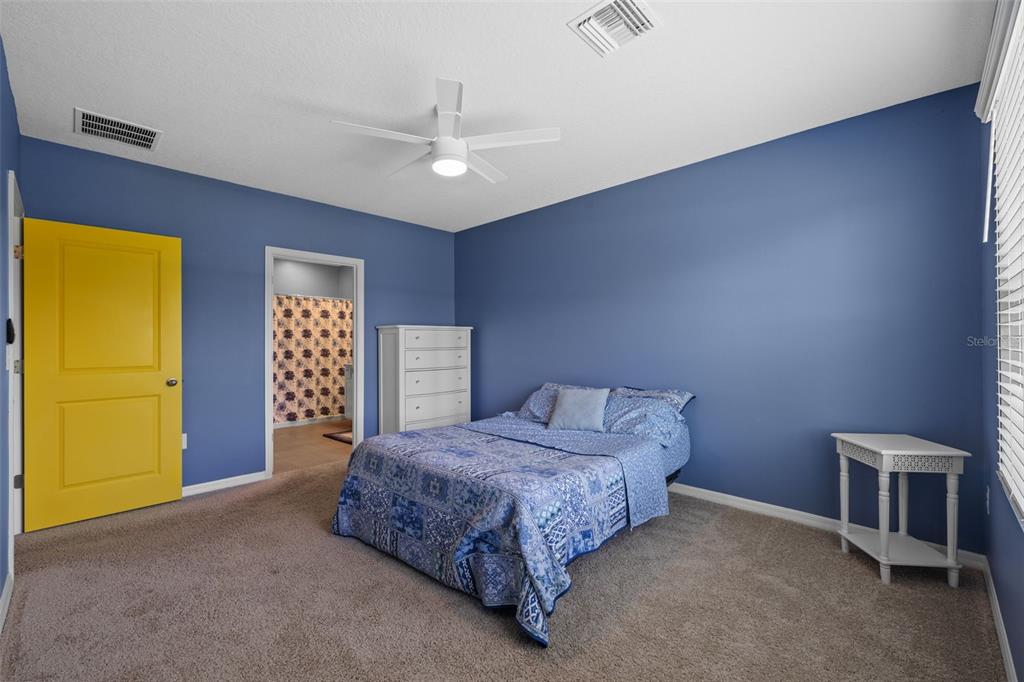 2721 Greenleaf Terrace Parrish, FL 34219 - Photo 32 of 65 a spacious bedroom with a bed and a table