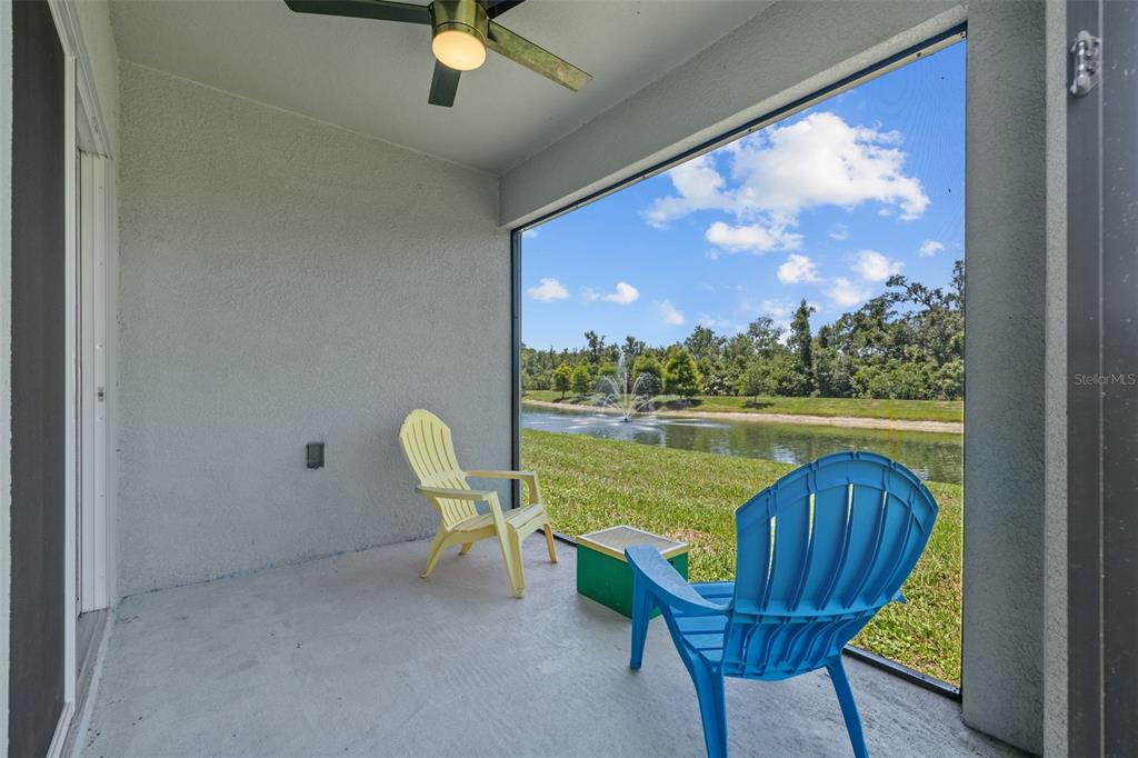 2721 Greenleaf Terrace Parrish, FL 34219 - Photo 40 of 65 a view of a swimming pool with a lounge chair and a floor to ceiling window