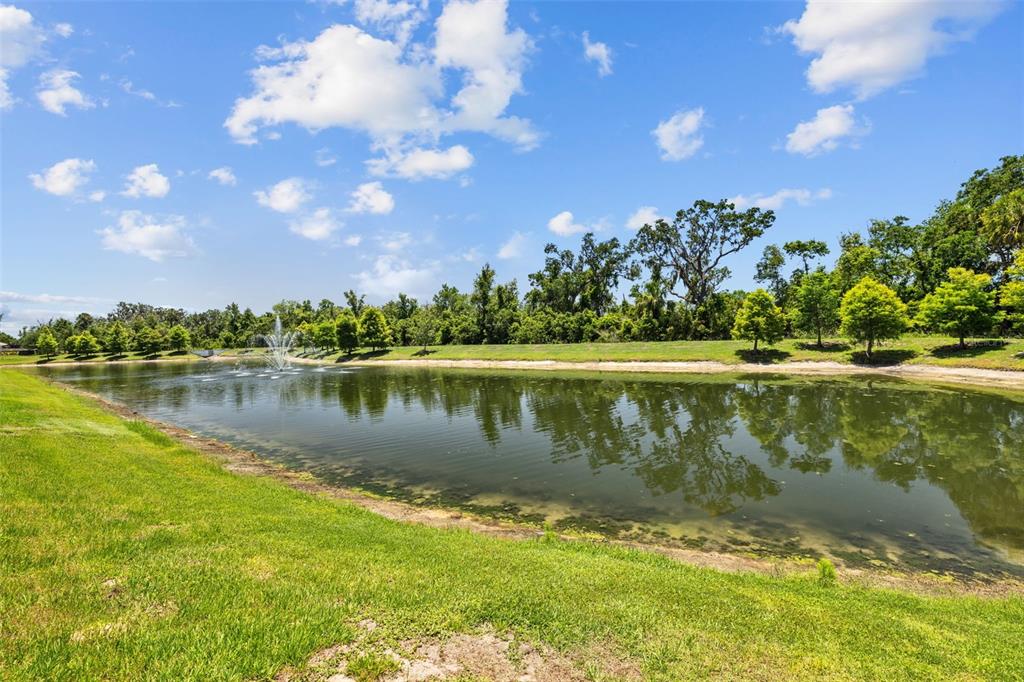 2721 Greenleaf Terrace Parrish, FL 34219 - Photo 43 of 65 a view of a lake with a house in the background