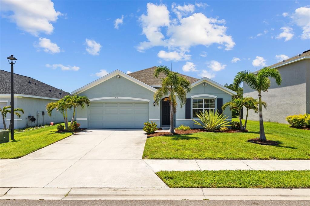 2721 Greenleaf Terrace Parrish, FL 34219 - Photo 5 of 65 a front view of a house with a yard and garage