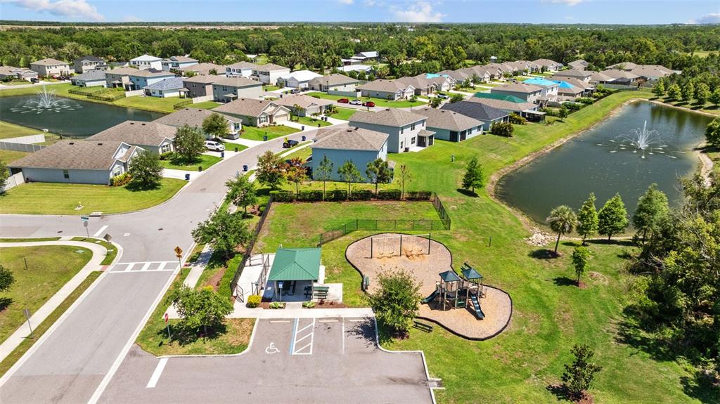 2721 Greenleaf Terrace Parrish, FL 34219 - Photo 64 of 65 an aerial view of a house with a lake view