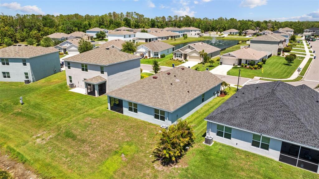 2721 Greenleaf Terrace Parrish, FL 34219 - Photo 65 of 65 an aerial view of a house with swimming pool and outdoor seating