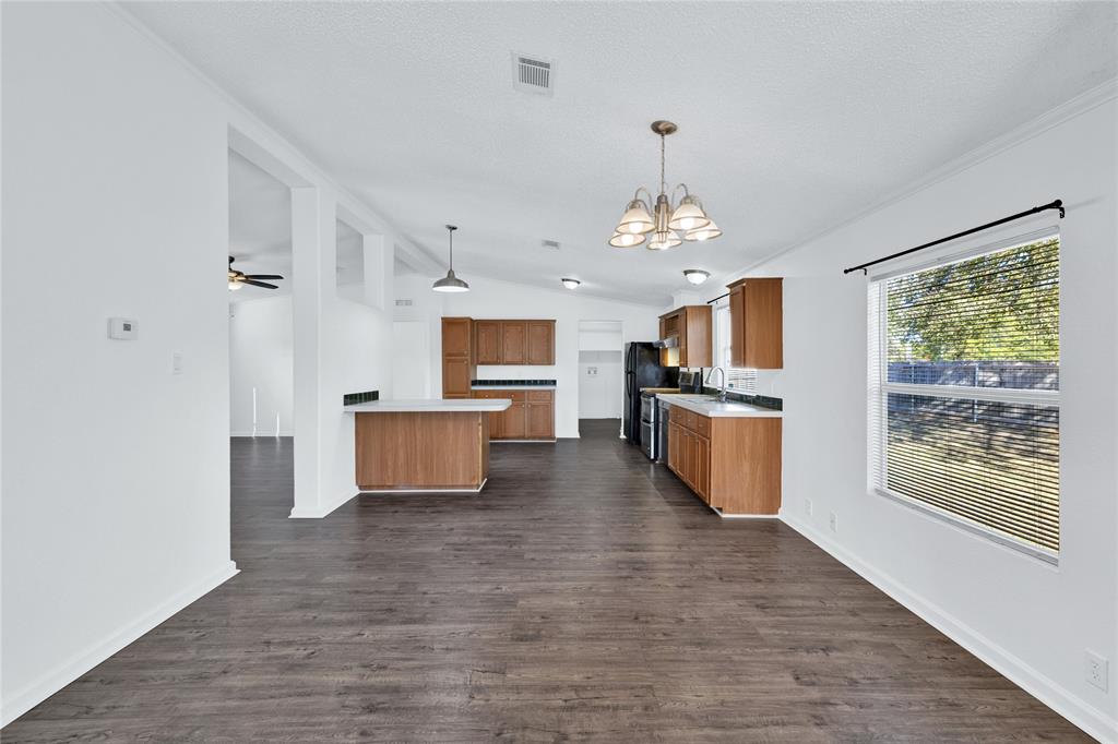 312 6th Street Joshua, TX 76058 - Photo 16 of 33 a open kitchen with stainless steel appliances granite countertop a stove and refrigerator
