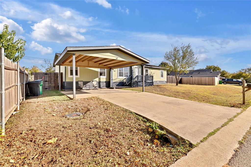 312 6th Street Joshua, TX 76058 - Photo 2 of 33 a view of a house with a yard