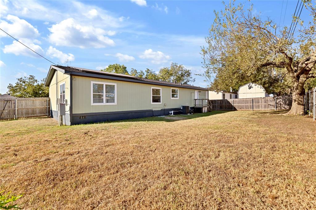 312 6th Street Joshua, TX 76058 - Photo 25 of 33 a front view of a house with a yard and covered with snow