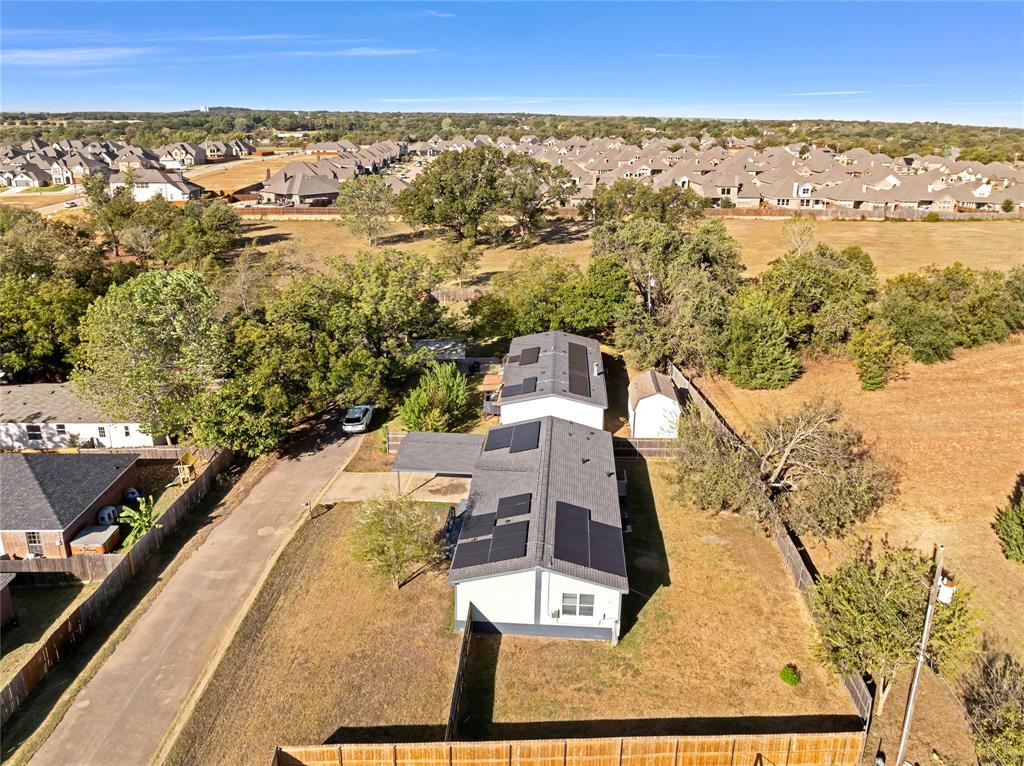 312 6th Street Joshua, TX 76058 - Photo 30 of 33 an aerial view of residential houses with outdoor space