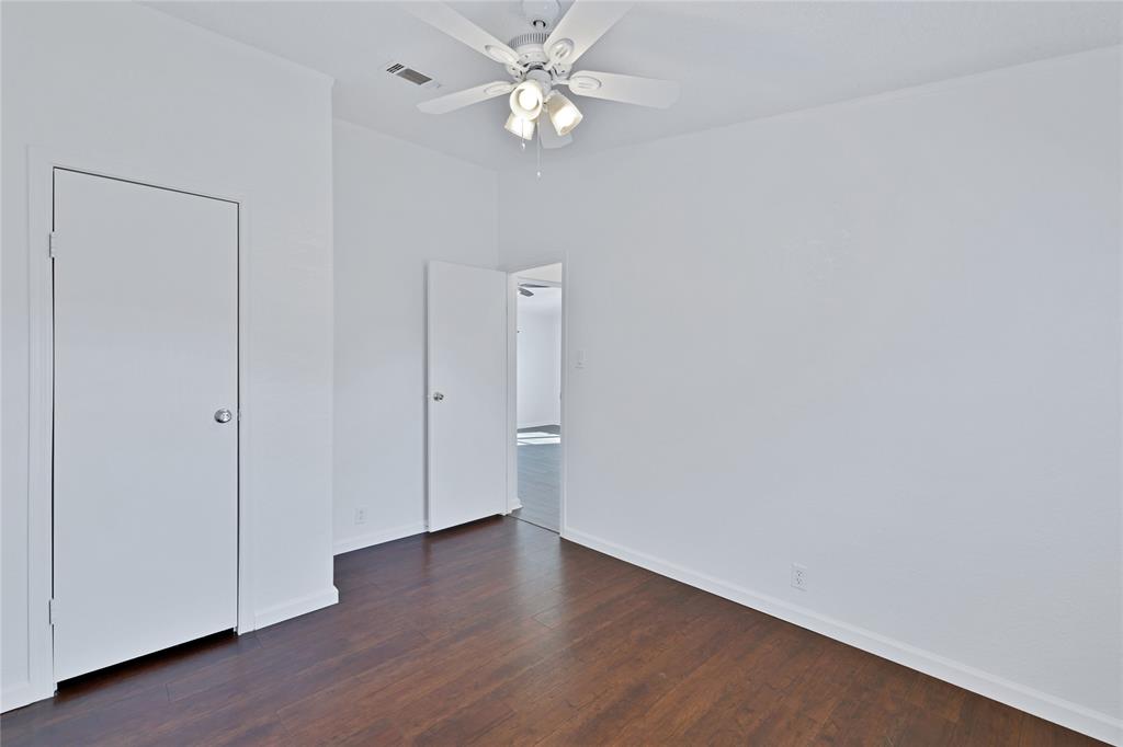 312 6th Street Joshua, TX 76058 - Photo 8 of 33 a view of an empty room with wooden floor