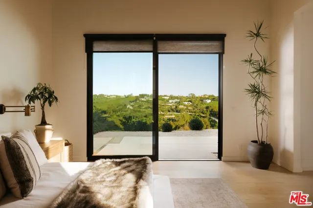 a view of a living room and a balcony