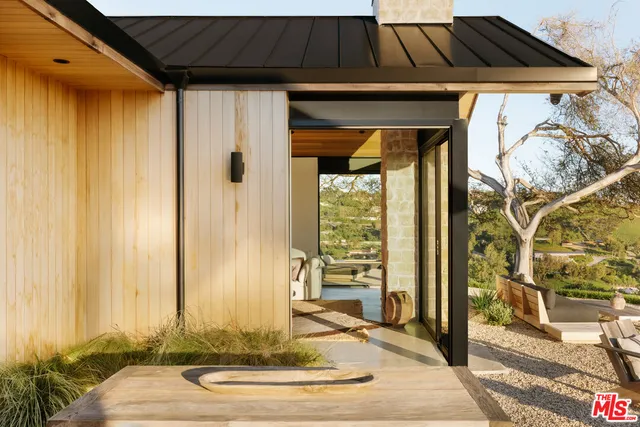 a front view of a house with a outdoor space