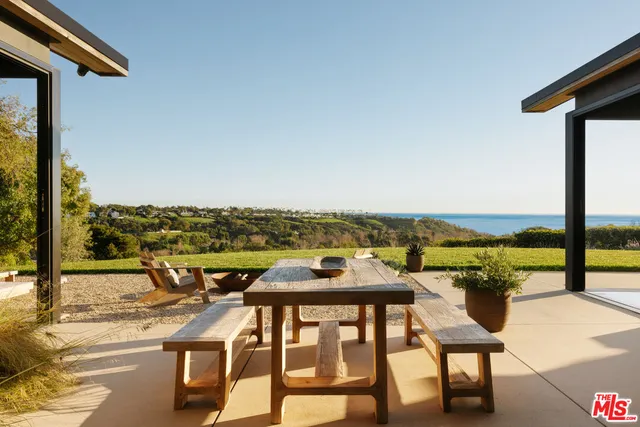 a view of a balcony with an ocean