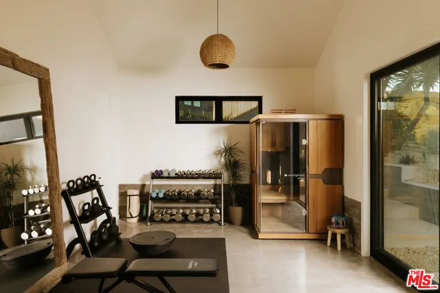 a view of a workspace with furniture and entryway