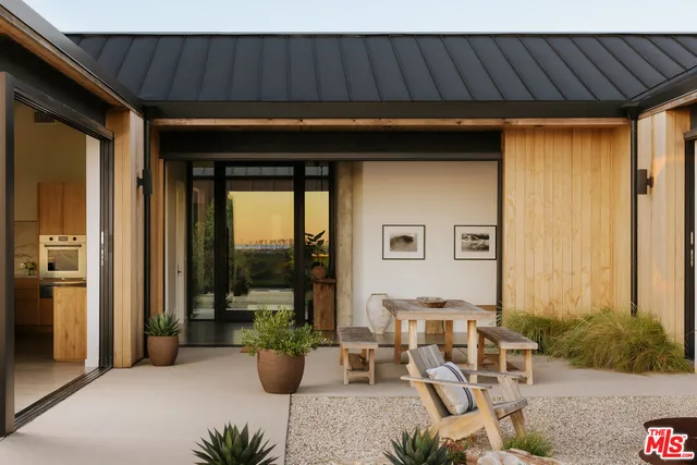 a backyard of a house with seating space