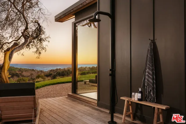 a view of a balcony with furniture