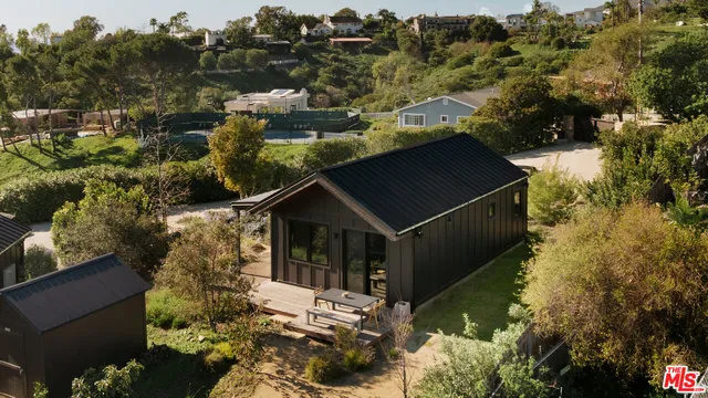 an aerial view of house with yard