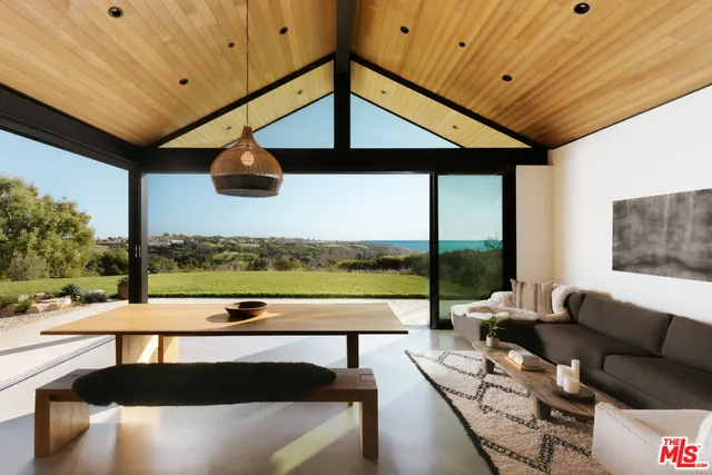 a view of swimming pool with seating space