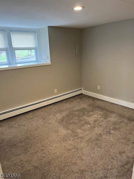 96 Ridgedale Avenue Madison, NJ 07940 - Photo 6 of 11 an empty room with a workbench