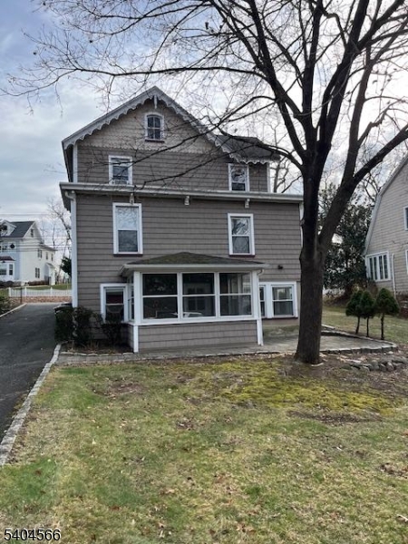 96 Ridgedale Avenue Madison, NJ 07940 - Photo 10 of 11 a house with trees in the background