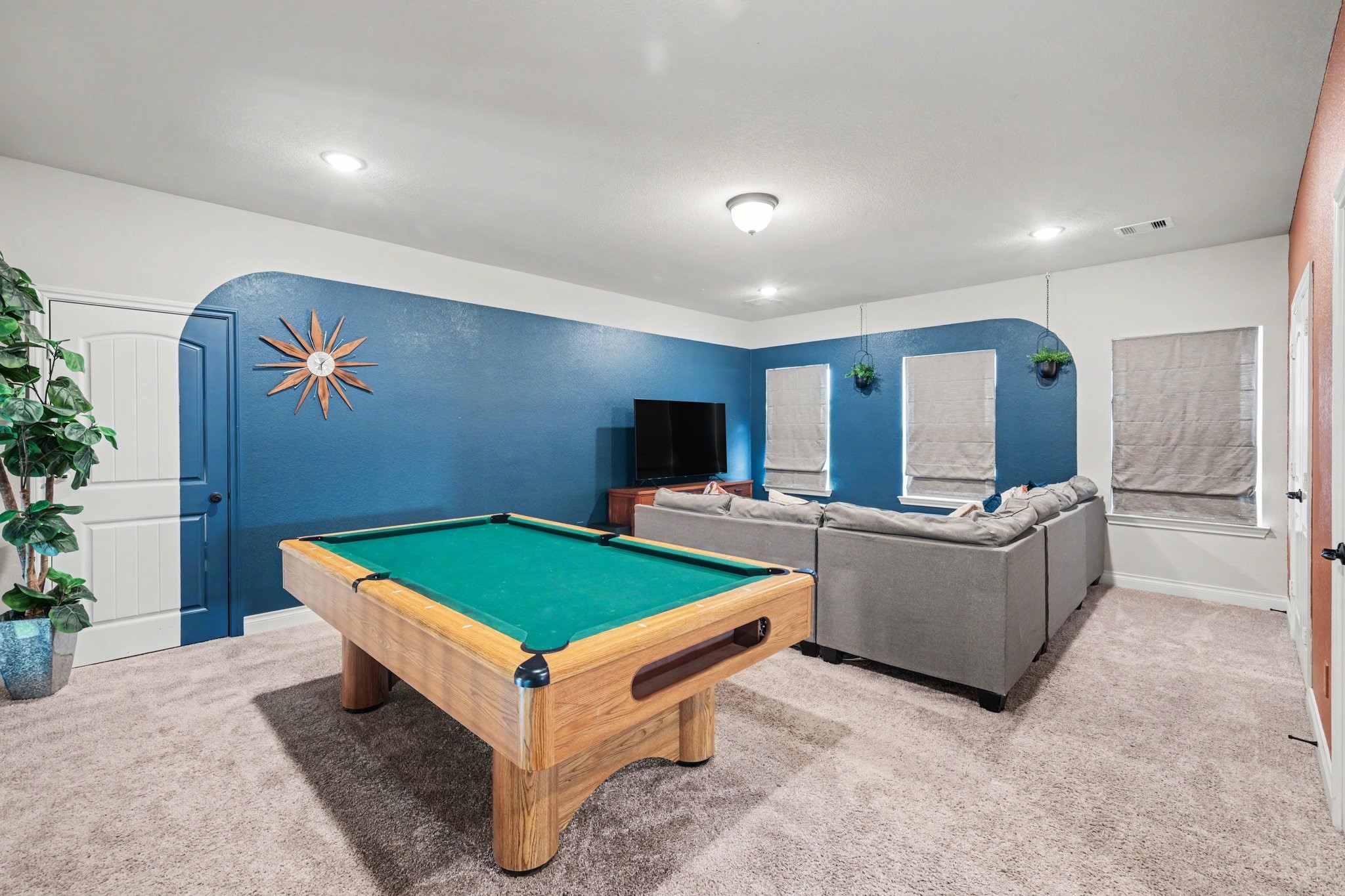 21006 Brave Legion Way Tomball, TX 77375 - Photo 20 of 29 a room with pool table and a flat screen tv