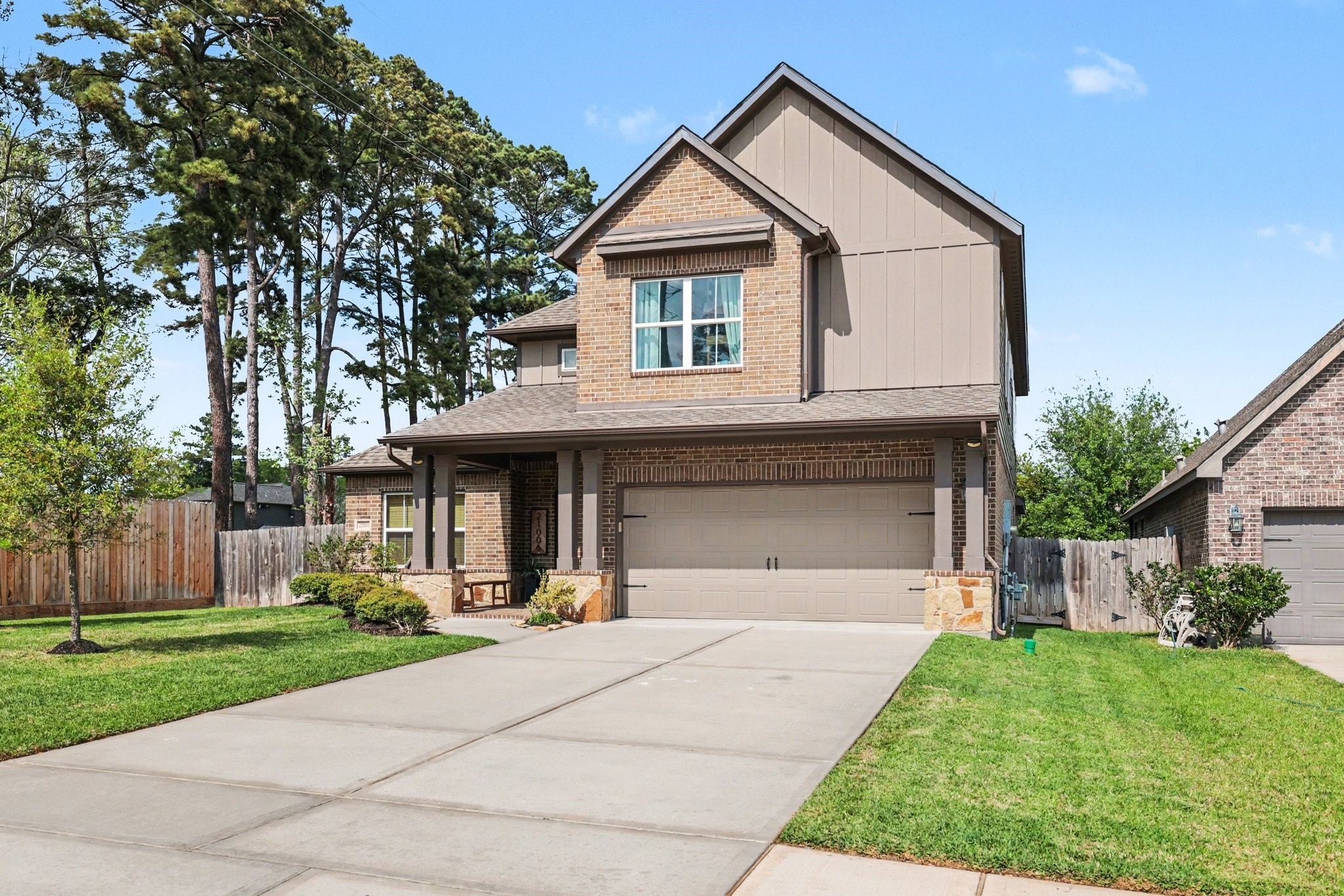 21006 Brave Legion Way Tomball, TX 77375 - Photo 2 of 29 a front view of a house with a yard