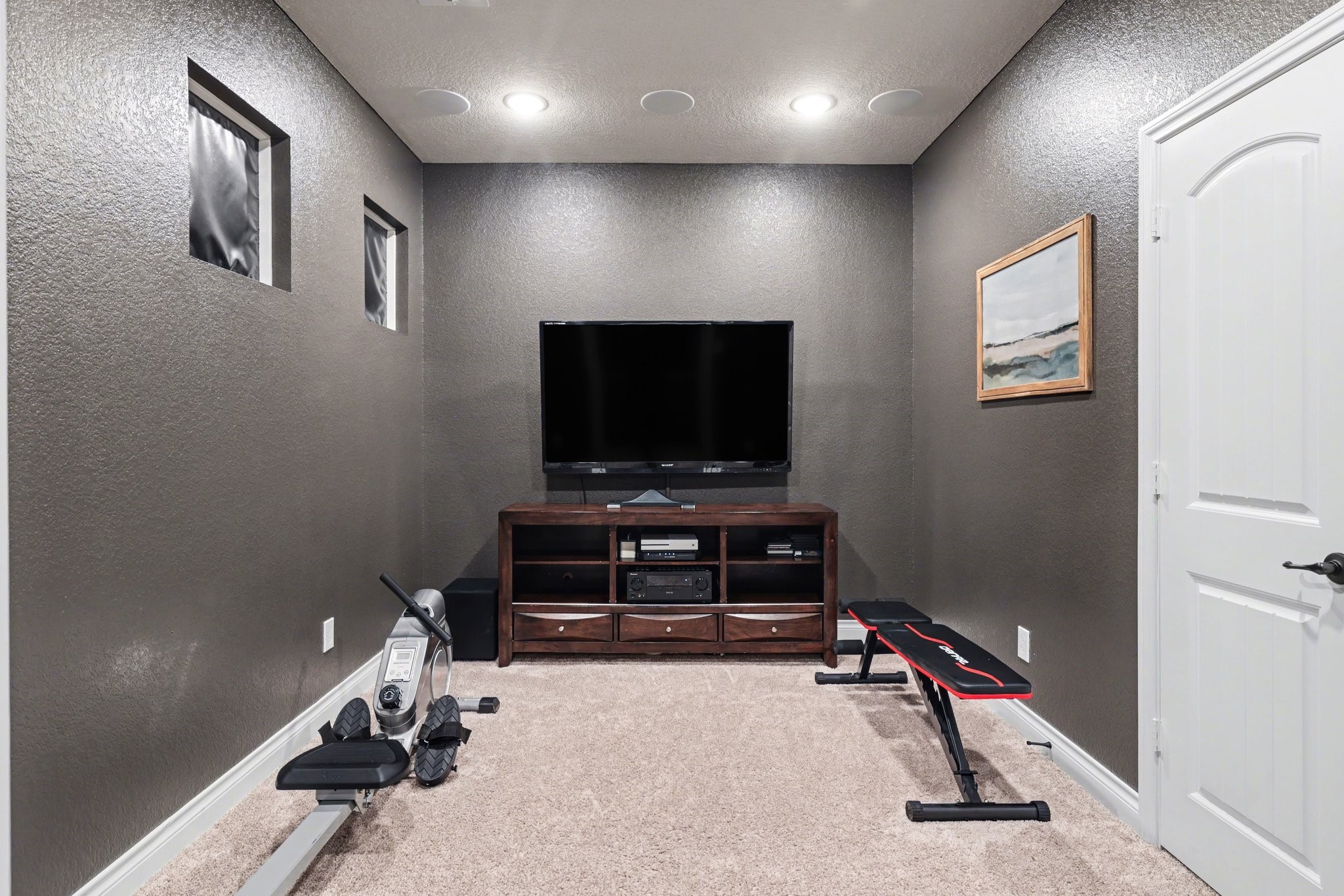 21006 Brave Legion Way Tomball, TX 77375 - Photo 21 of 29 a room with gym equipment and a flat screen tv