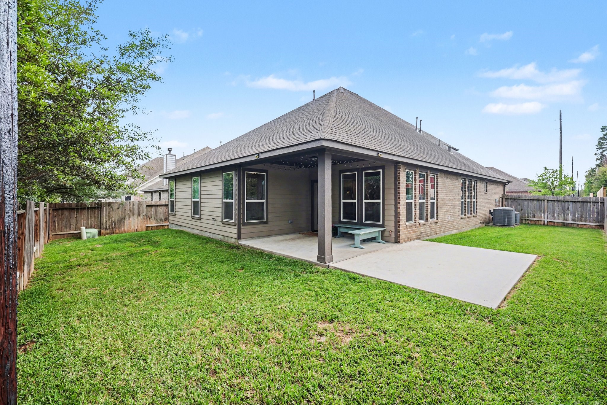 21006 Brave Legion Way Tomball, TX 77375 - Photo 26 of 29 a view of an house with backyard space and garden