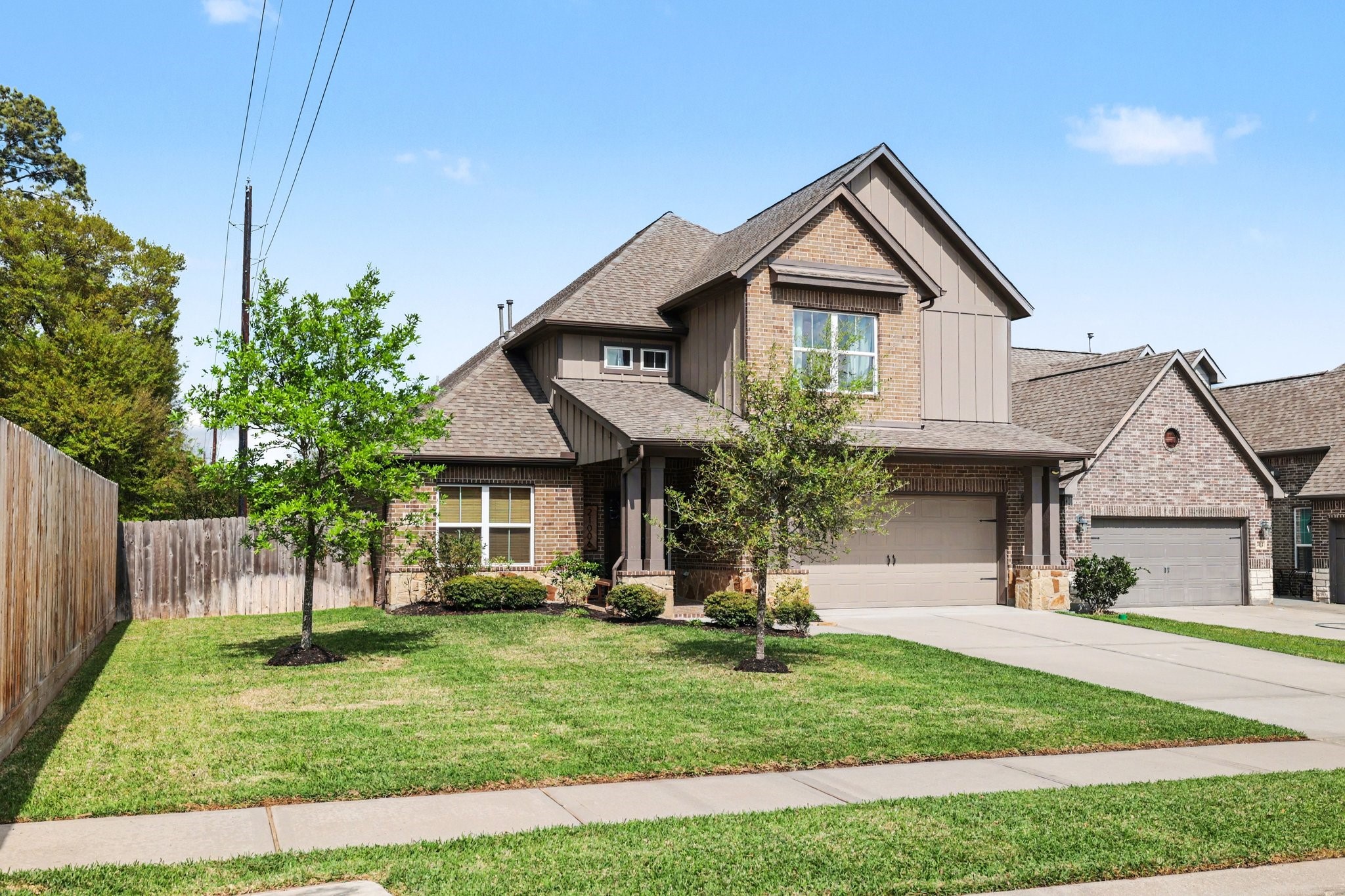 21006 Brave Legion Way Tomball, TX 77375 - Photo 27 of 29 a front view of a house with a yard