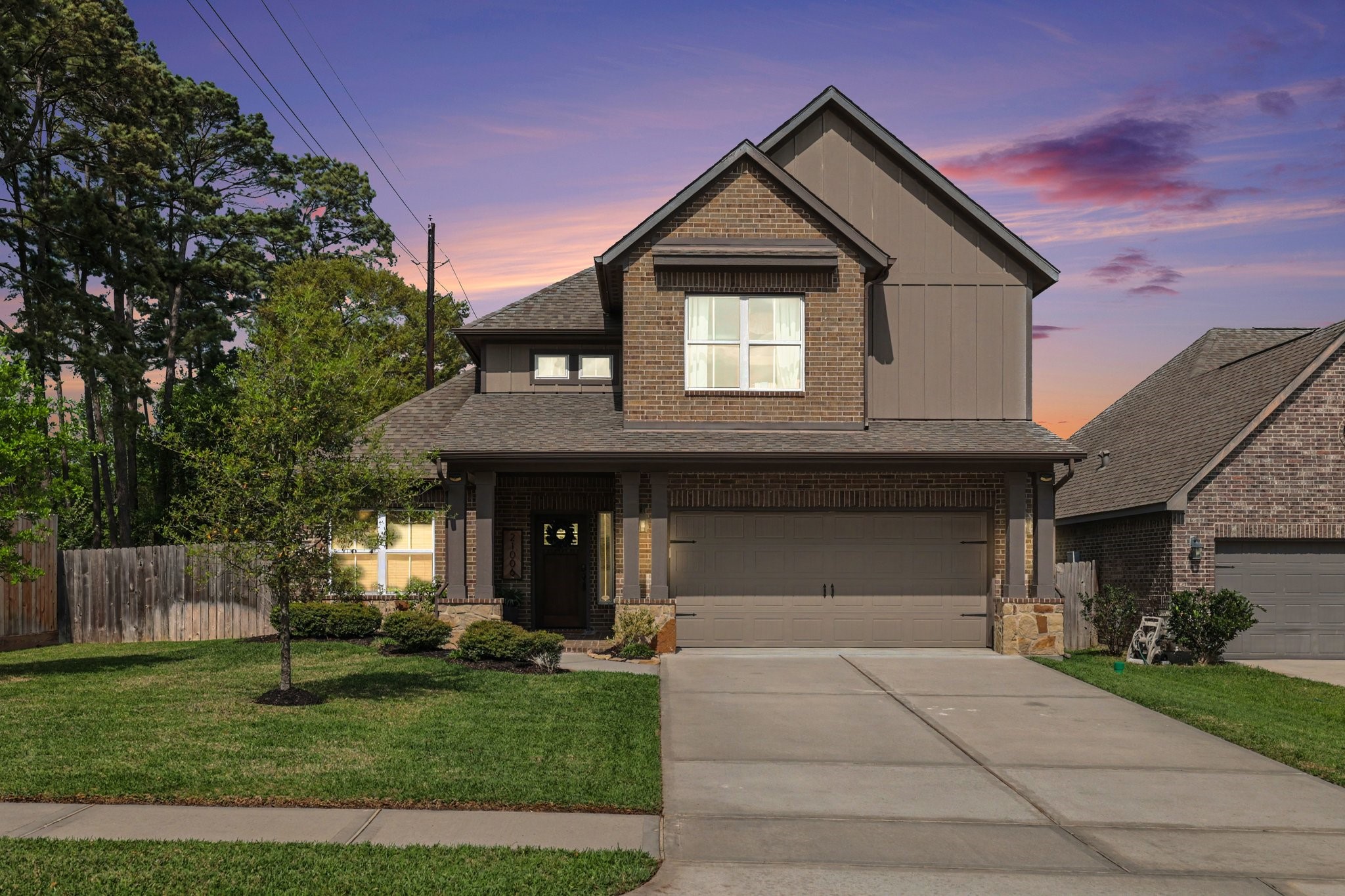 21006 Brave Legion Way Tomball, TX 77375 - Photo 3 of 29 a front view of a house with a yard