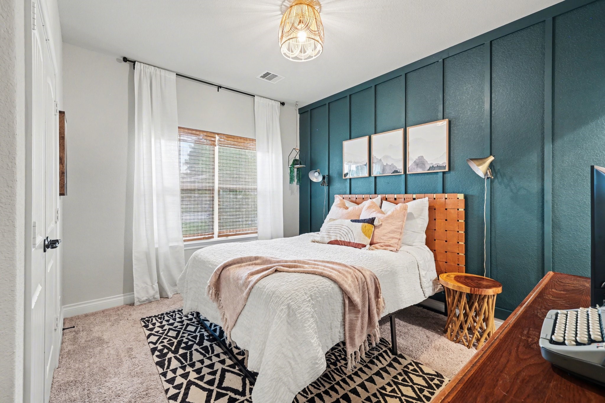 21006 Brave Legion Way Tomball, TX 77375 - Photo 6 of 29 a bedroom with a bed and a chandelier