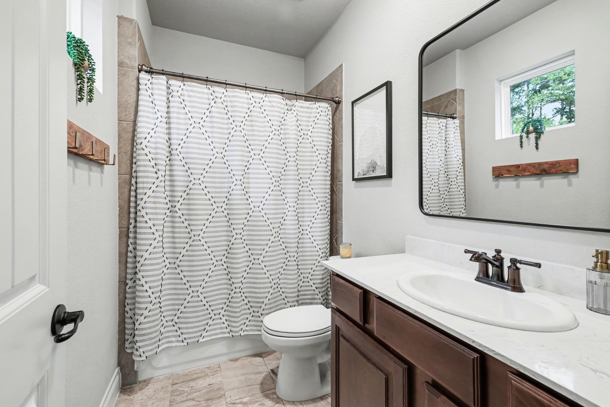 21006 Brave Legion Way Tomball, TX 77375 - Photo 7 of 29 a bathroom with a granite countertop sink toilet and mirror