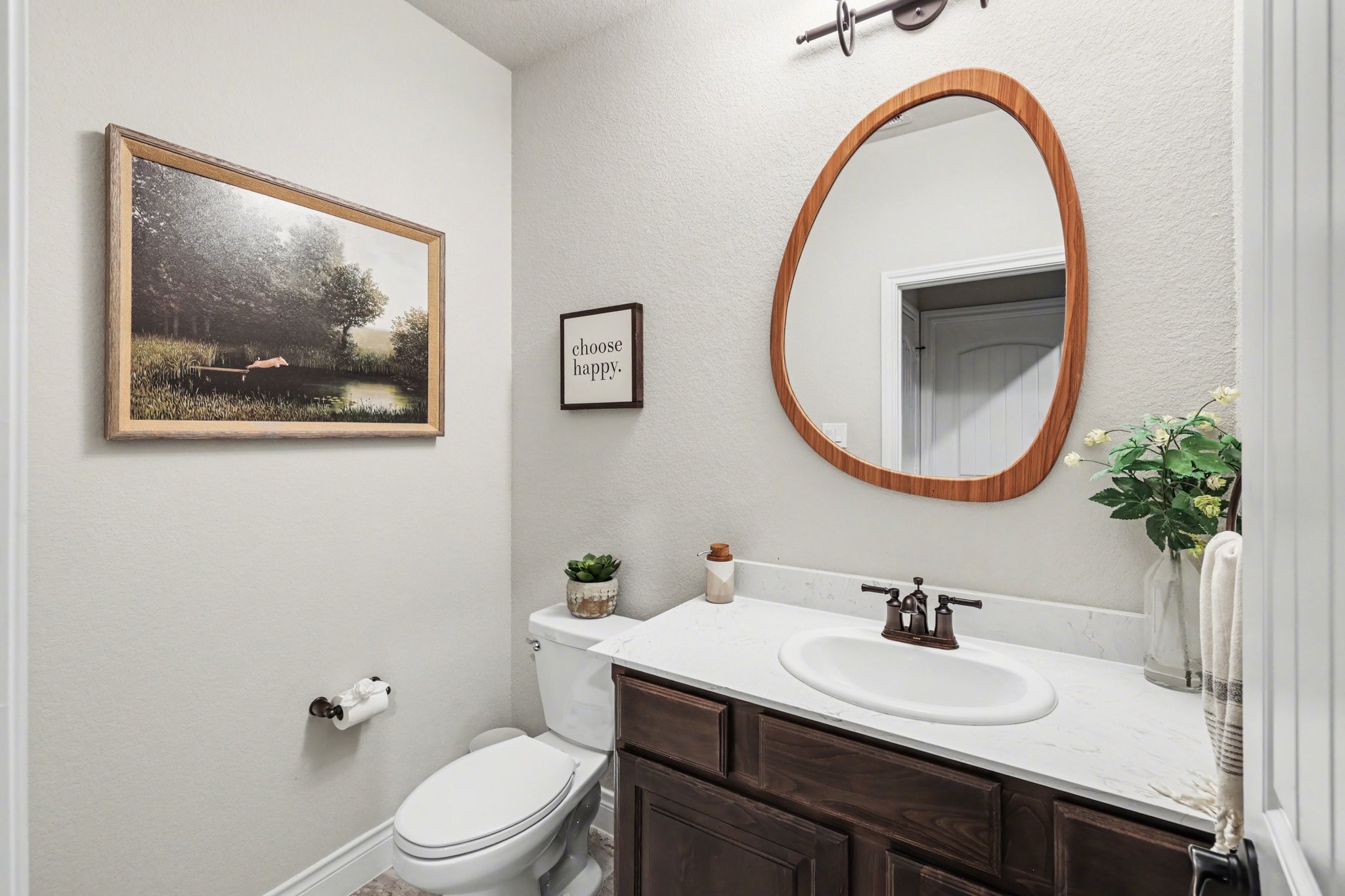 21006 Brave Legion Way Tomball, TX 77375 - Photo 8 of 29 a bathroom with a toilet a sink and a mirror