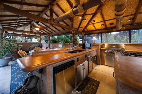 a room with stainless steel appliances lots of counter space