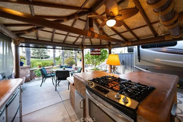 a outdoor space with lots of furniture and stainless steel appliances