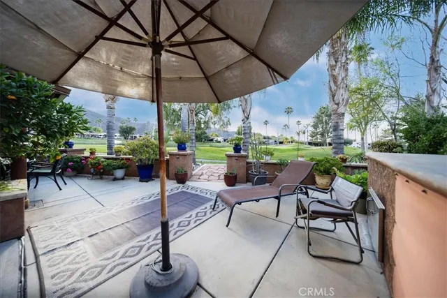 a view of a backyard with sitting area
