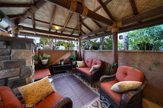 a outdoor living space with furniture and a fireplace