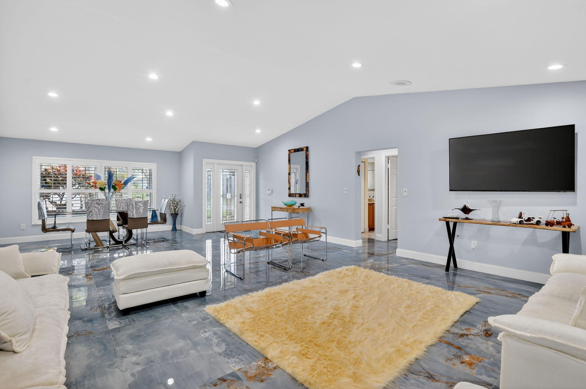 10294 Crosswind Road Boca Raton, FL 33498 - Photo 11 of 71 a living room with furniture and a flat screen tv