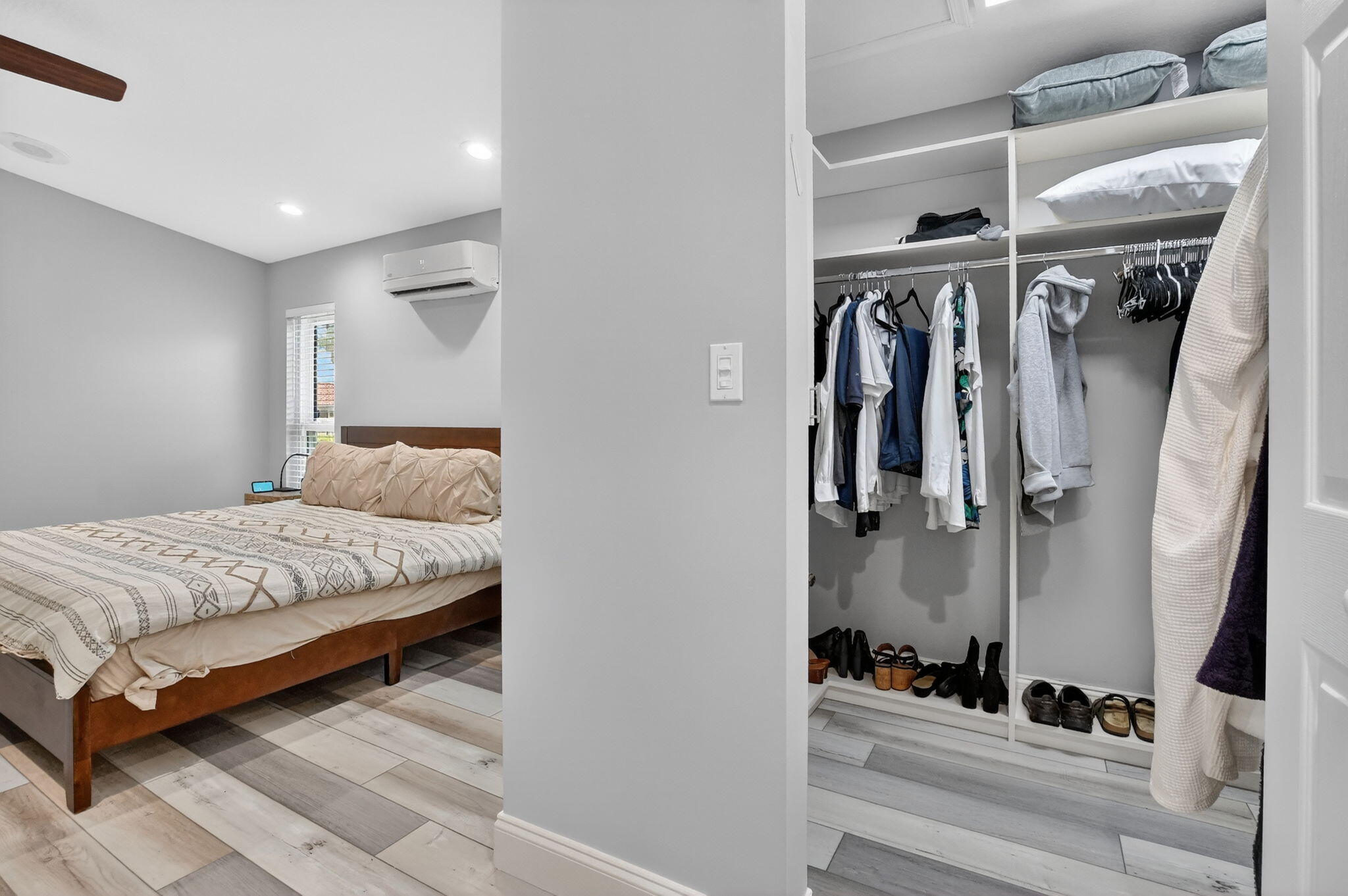 10294 Crosswind Road Boca Raton, FL 33498 - Photo 33 of 71 a bedroom with a large bed and a mirror