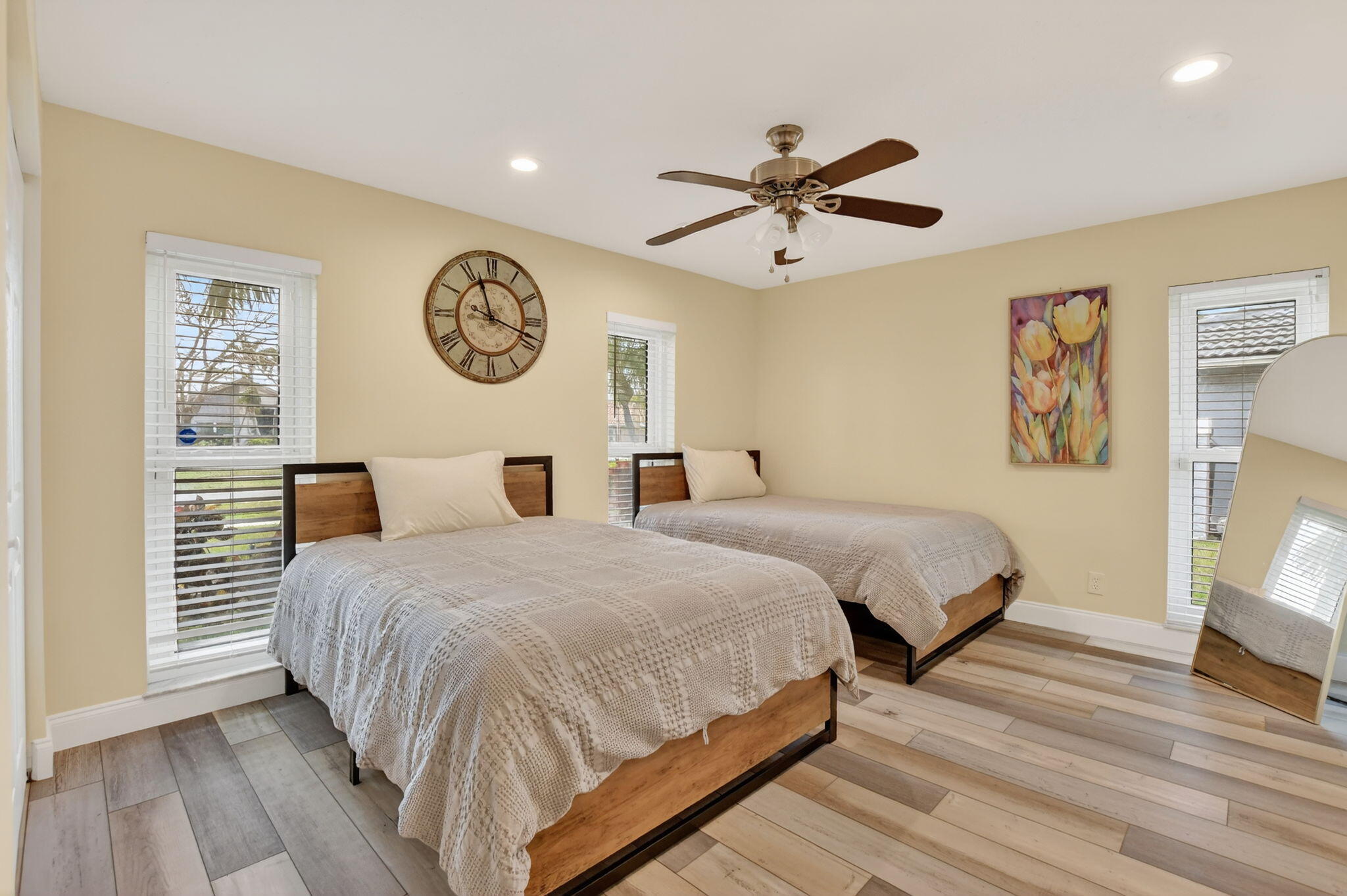 10294 Crosswind Road Boca Raton, FL 33498 - Photo 34 of 71 a bedroom with a bed and a chandelier