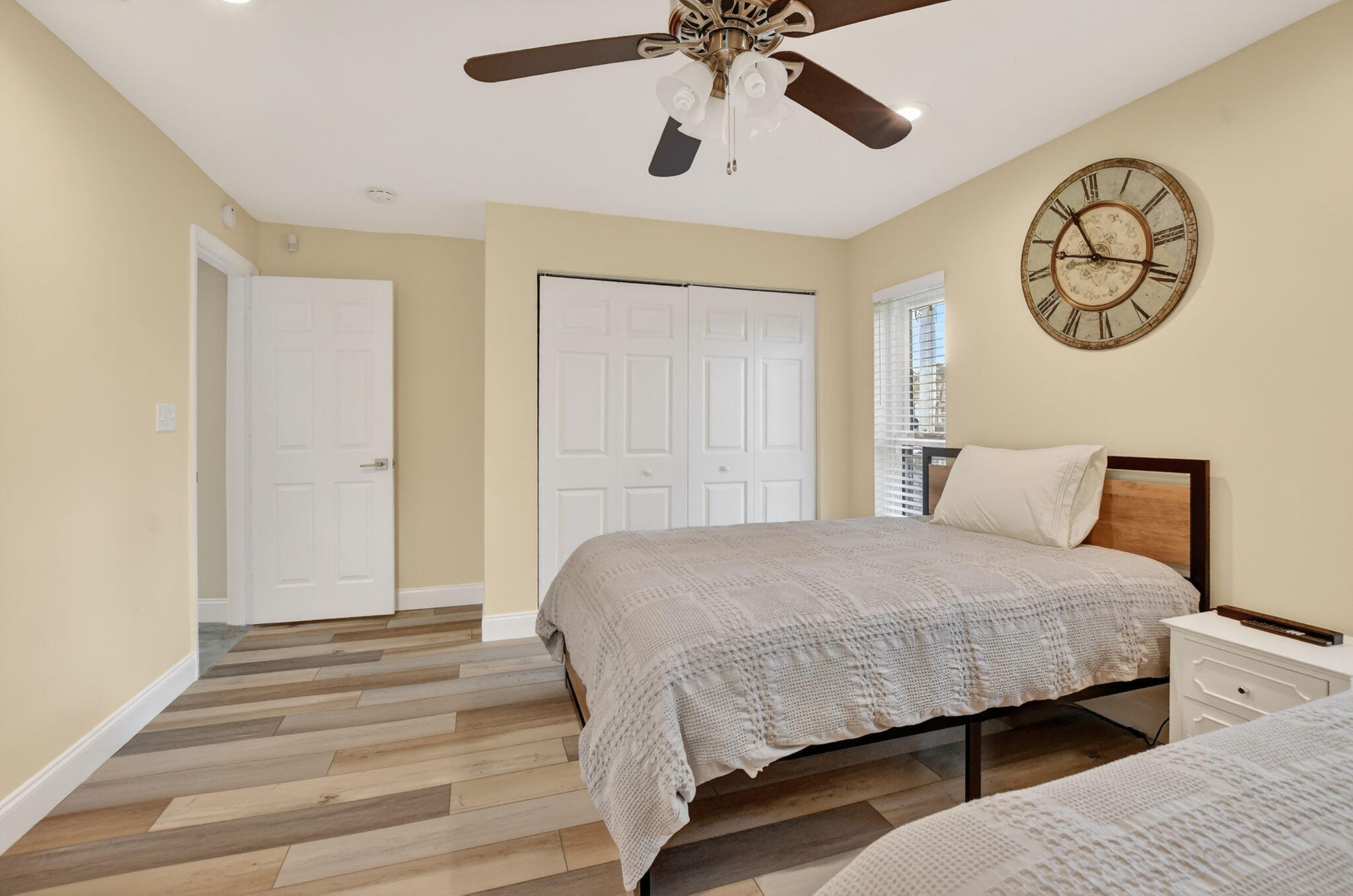 10294 Crosswind Road Boca Raton, FL 33498 - Photo 35 of 71 a bedroom with a bed and a chandelier