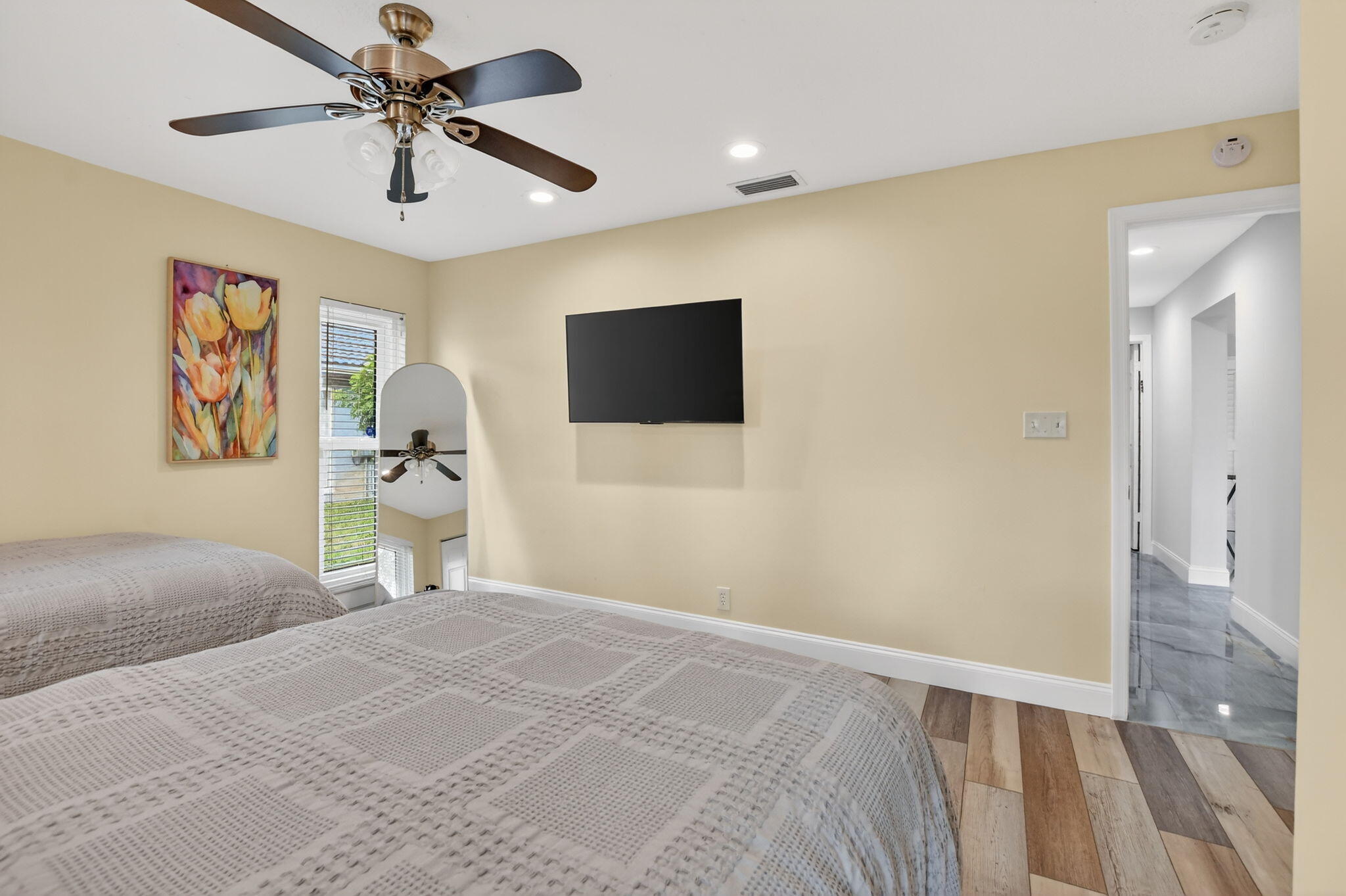 10294 Crosswind Road Boca Raton, FL 33498 - Photo 36 of 71 a bedroom with a bed and a flat screen tv