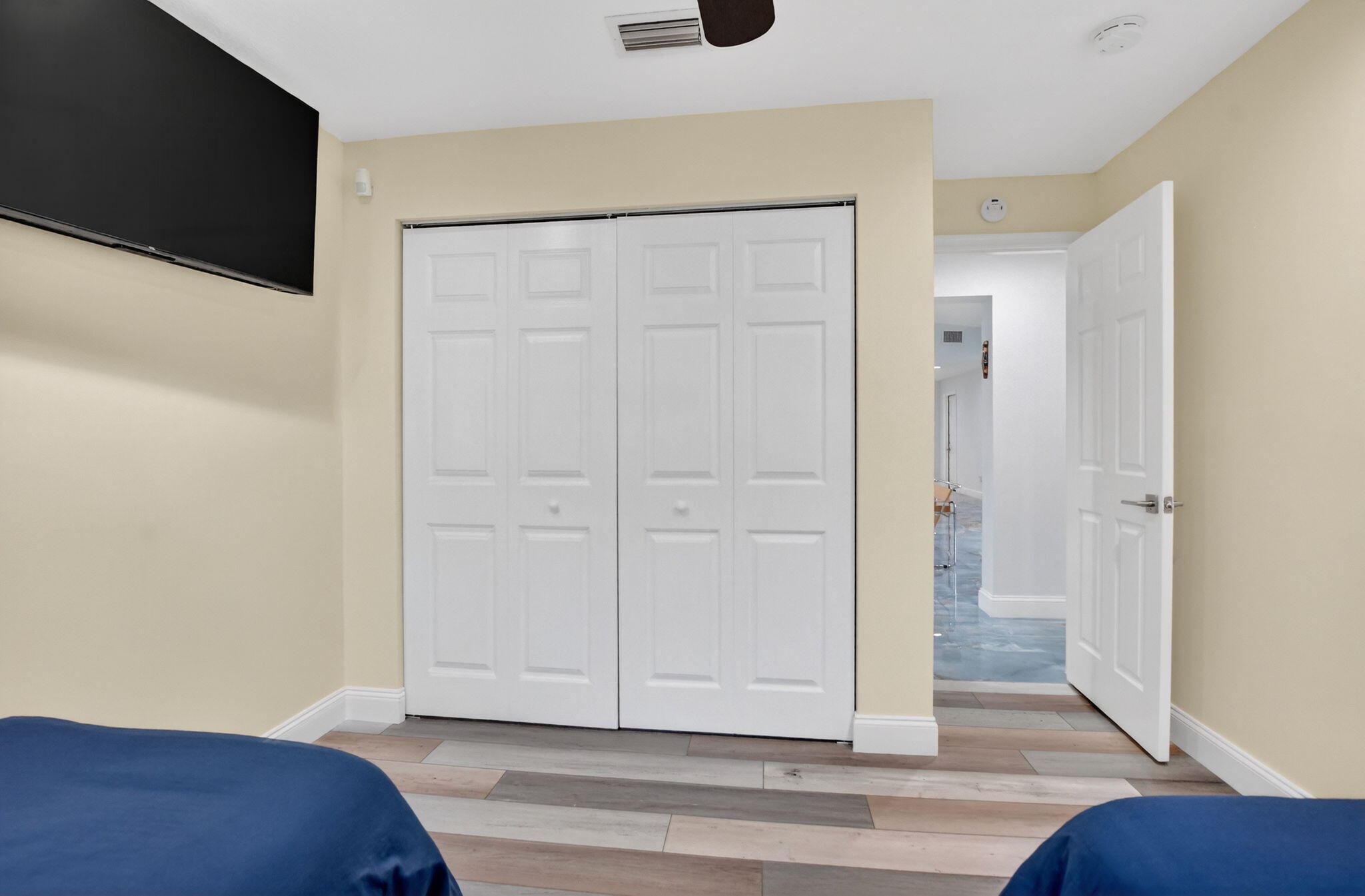10294 Crosswind Road Boca Raton, FL 33498 - Photo 38 of 71 a view of bedroom with a flat tv screen and hardwood floor