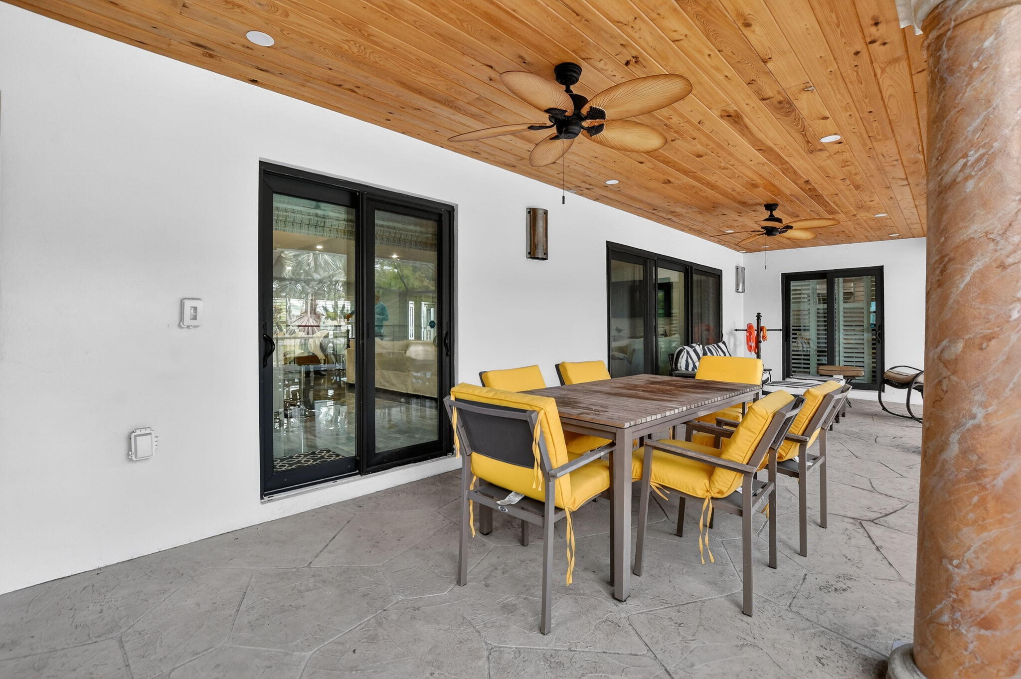 10294 Crosswind Road Boca Raton, FL 33498 - Photo 46 of 71 a patio with table and chairs