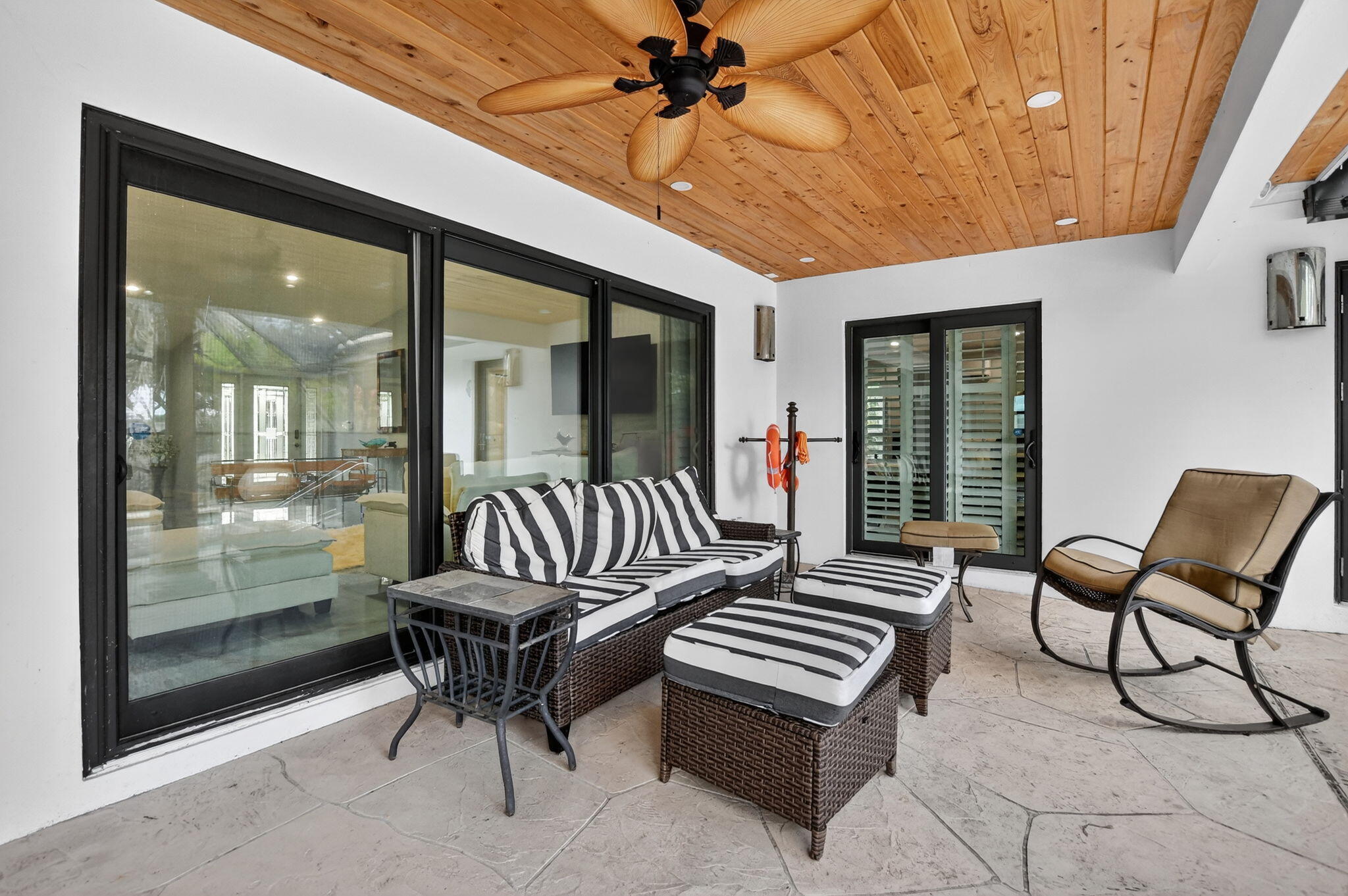 10294 Crosswind Road Boca Raton, FL 33498 - Photo 47 of 71 a outdoor living space with couple of furniture and a potted plant