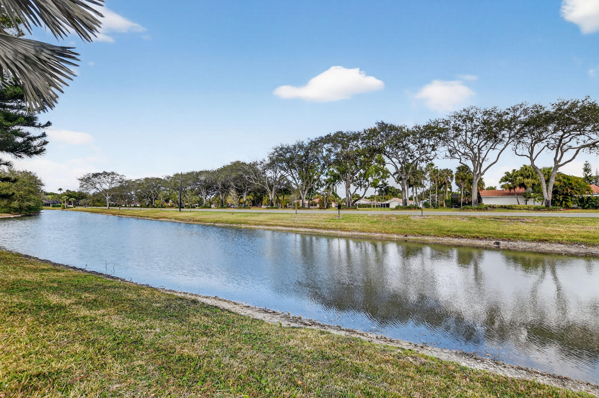 10294 Crosswind Road Boca Raton, FL 33498 - Photo 55 of 71 a view of a lake with houses in the back