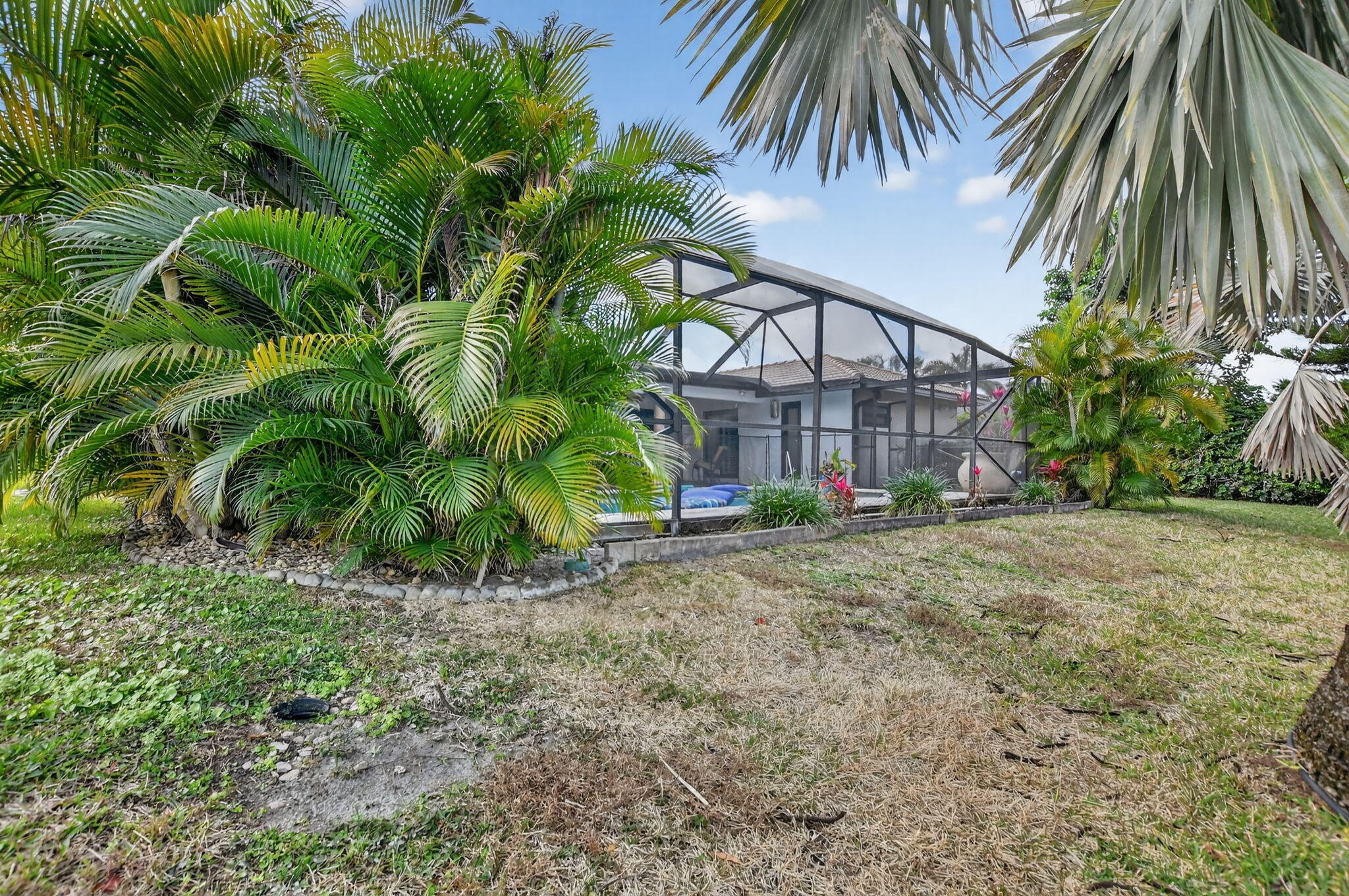 10294 Crosswind Road Boca Raton, FL 33498 - Photo 58 of 71 a view of a yard with a house