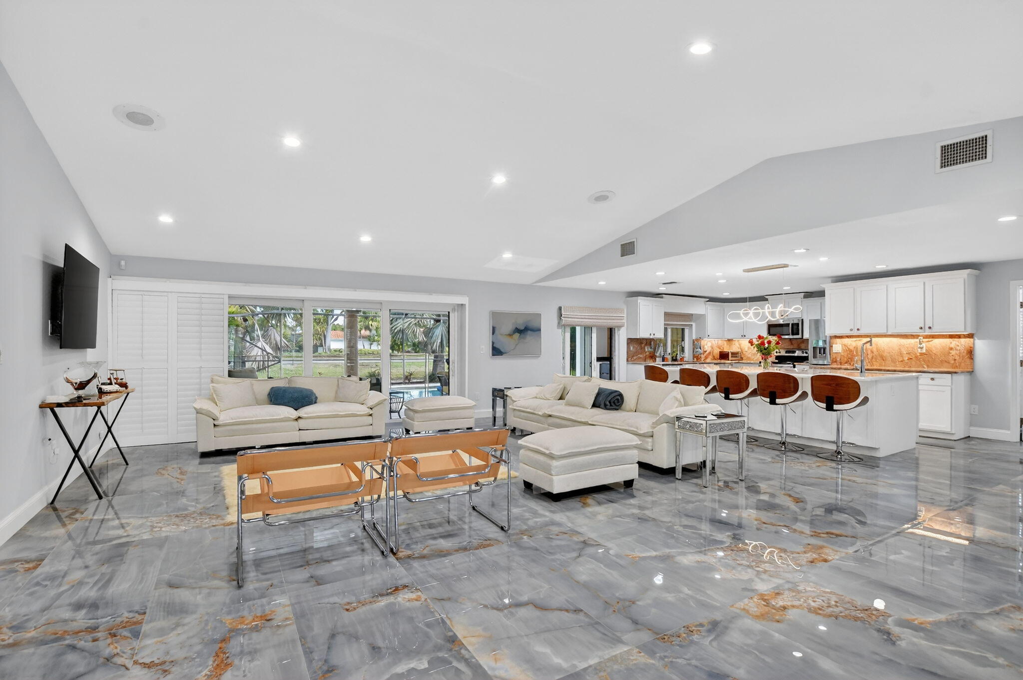 10294 Crosswind Road Boca Raton, FL 33498 - Photo 6 of 71 a living room with furniture and a flat screen tv