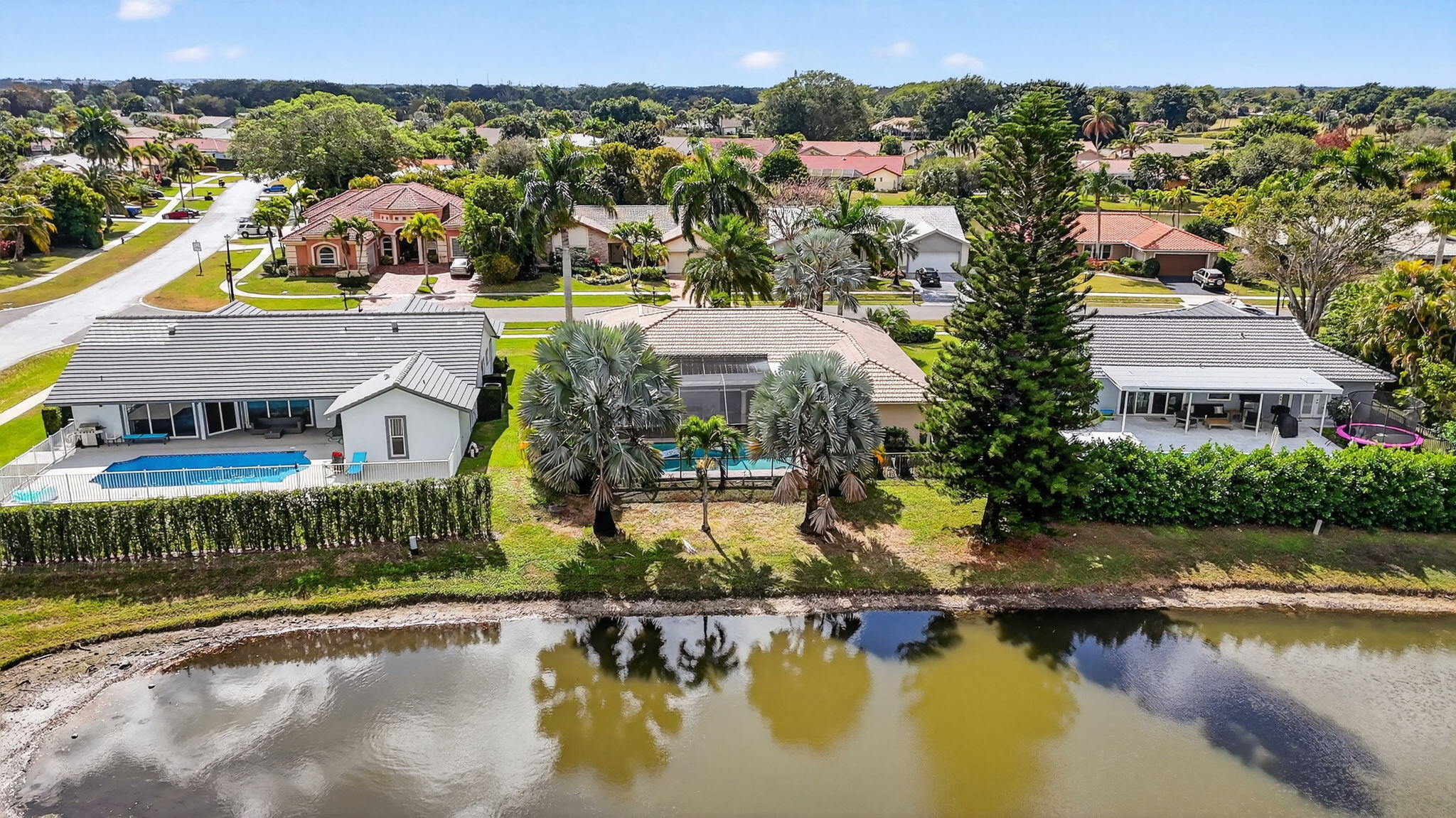 10294 Crosswind Road Boca Raton, FL 33498 - Photo 69 of 71 an aerial view of house with yard and lake view