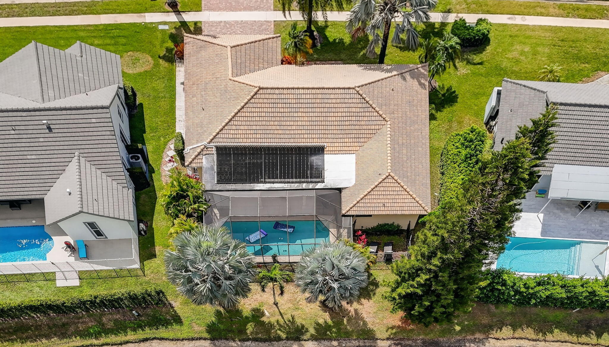 10294 Crosswind Road Boca Raton, FL 33498 - Photo 71 of 71 a aerial view of a house with a yard and potted plants