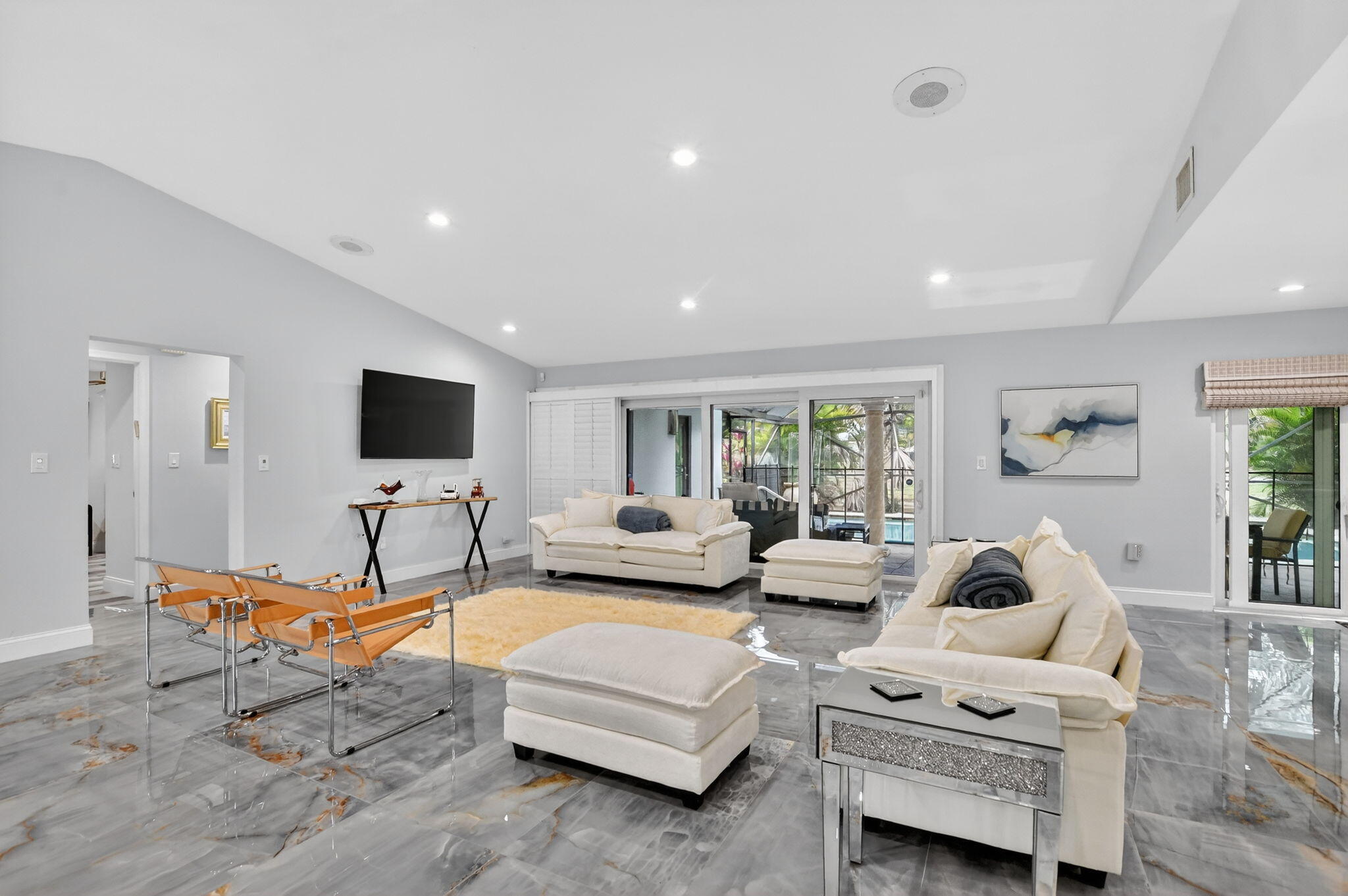 10294 Crosswind Road Boca Raton, FL 33498 - Photo 9 of 71 a living room with furniture and a flat screen tv